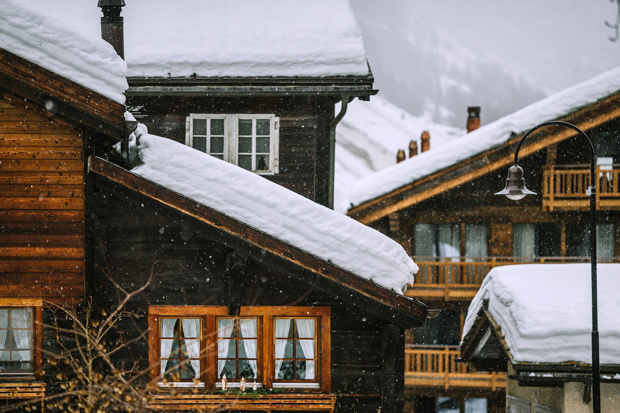 Snow-covered chalets in a French Alps village