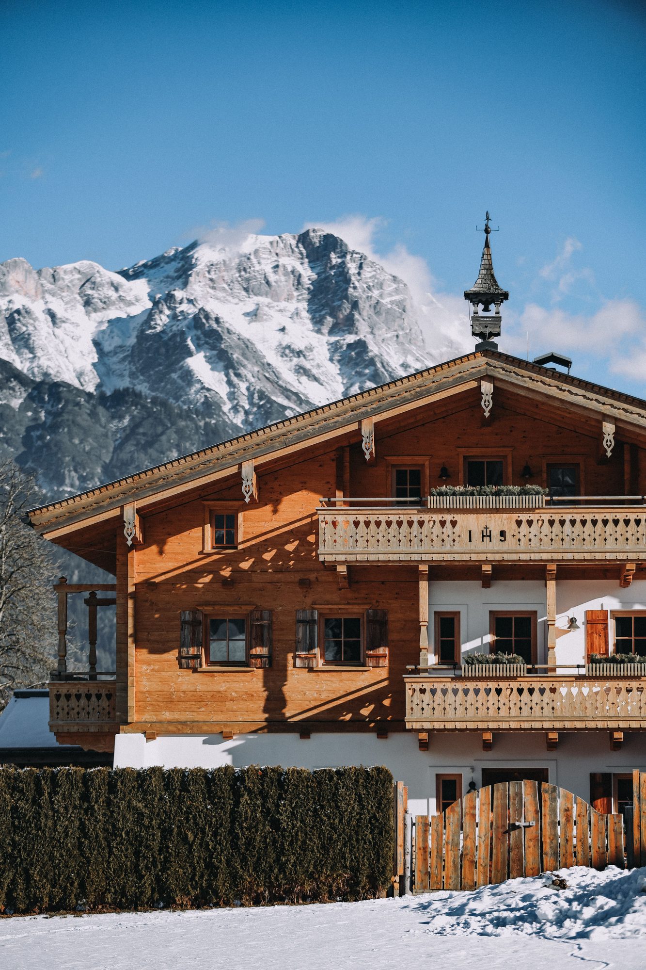Traditional chalet beneath snowy peaks in Megeve